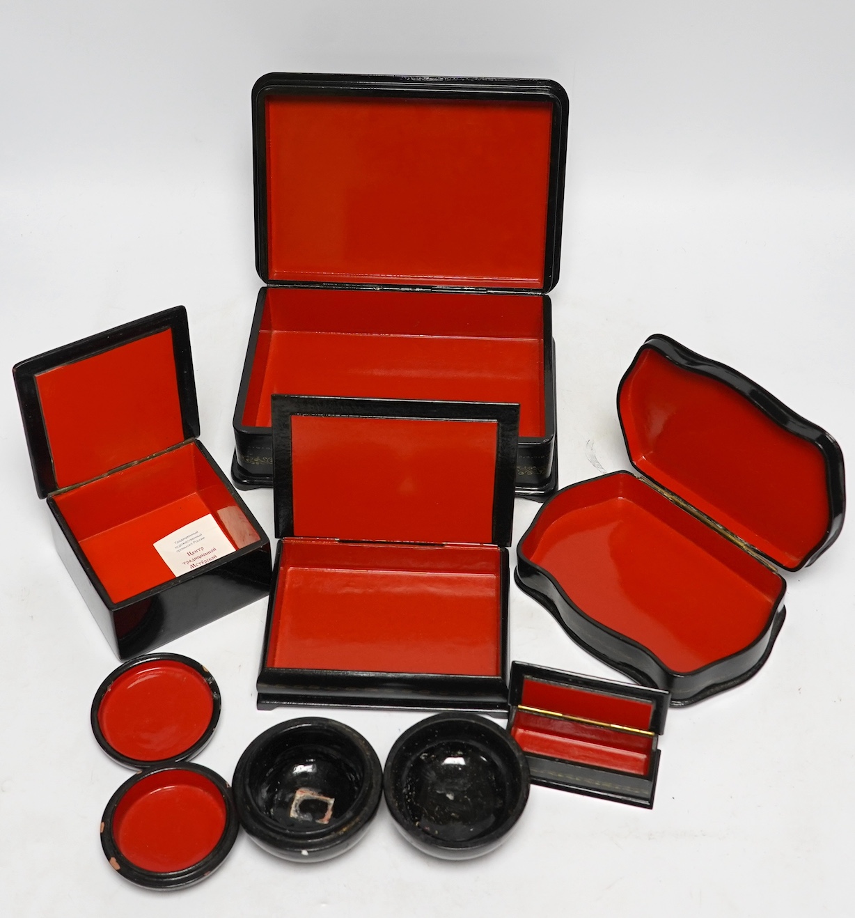 Seven Russian lacquer boxes, largest 21.5cm wide